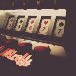 a slot machine with playing cards on it