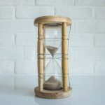 clear hour glass with brown frame