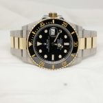 a black and gold rolex watch on a white background