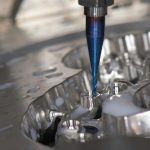 stainless steel and blue hand tool